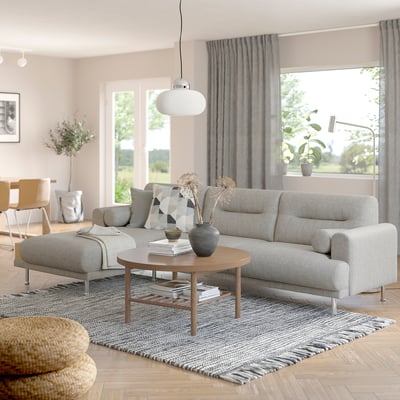 Modern living room with LÅNGARYD sofa, coffee table, and large windows.