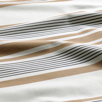 Striped pillowcase, beige tones, multi-pattern, soft fabric.