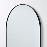 Modern arched mirror, black frame.