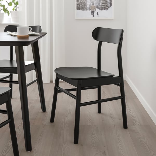 Modern black LISABO chair & table set. Minimalist design, sturdy wood, fits compact spaces.