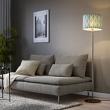Modern living room with grey LÖKNÄS lamp, sofa, side table, plants, and picture.