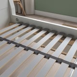 A close-up of the LÖNSET adjustable slatted bed base with curved slats and support zones for spine alignment.
