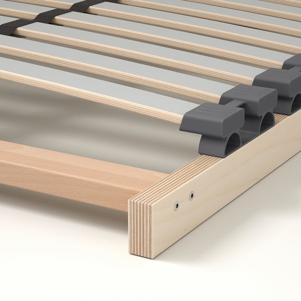 Slatted bed base with adjustable support for comfort. Wooden slats and grey holders for even weight distribution and spine alignment.