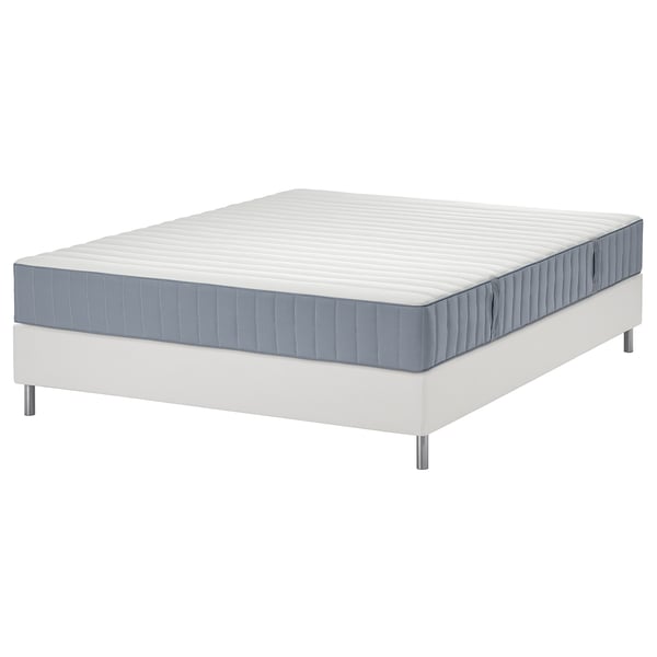 White lyngor mattress on white bed base, rectangular, foam-topped, spring-suspended.