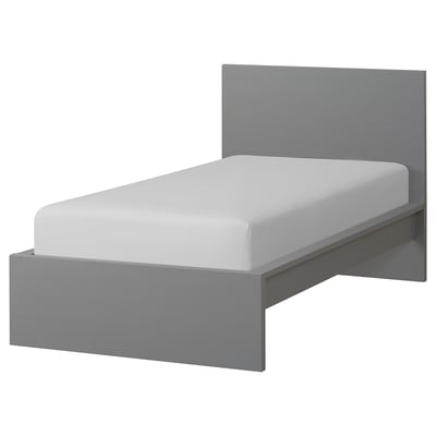 Minimalist grey MALM bed with white mattress, sleek design, grey wood, rectangular shape.