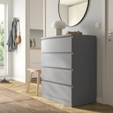 Grey MALM chest with 4 drawers, lamp, next to door.