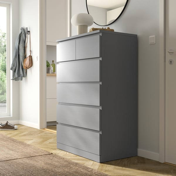 Gray MALM chest with 5 drawers in hallway.