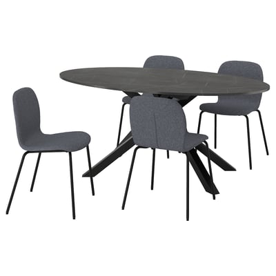 Black round dining table with 4 gray fabric chairs.