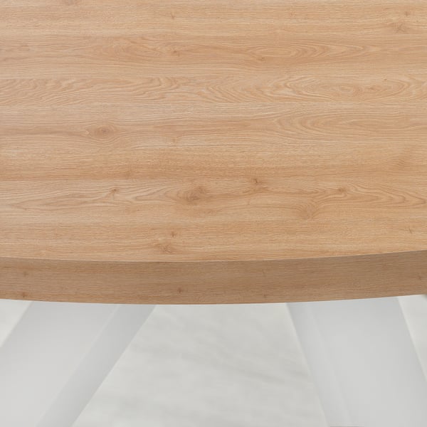 A smoothly finished wooden table top with light wood grain pattern and rounded edges.