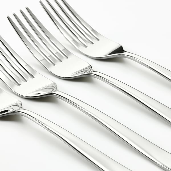 Multiple polished forks arranged neatly, reflecting light; high-quality silverware.