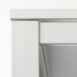Close-up of white MELLTORP furniture corner, showing sturdy steel legs with quality powder coating.