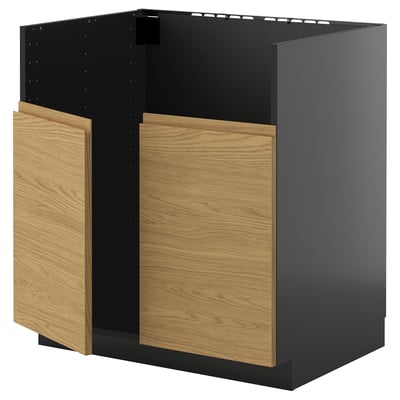 A modern black kitchen cabinet with wooden doors.
