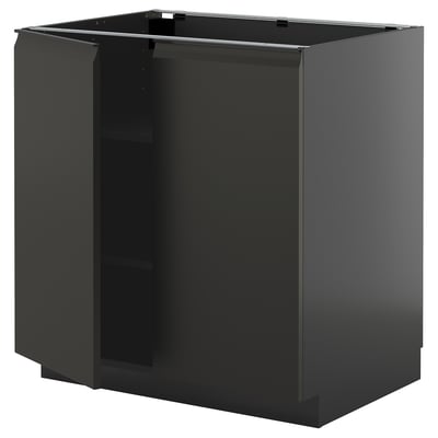 Black METOD corner cabinet with matte finish and metal handles.