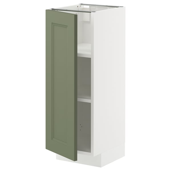 White kitchen cabinet with green door open, showing shelves.