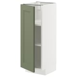 White kitchen cabinet with green door open, showing shelves.