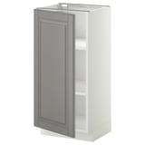 A white METOD kitchen cabinet with a grey door, featuring a traditional design with bevelled edges.