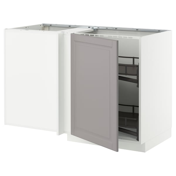 A modern kitchen unit, METOD brand, gray bodbyn doors with beveled edges, white frame, open for access, corner base cabinet design.