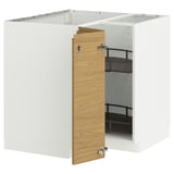 A white METOD kitchen cabinet with a light oak door partially open, revealing adjustable black shelves inside.