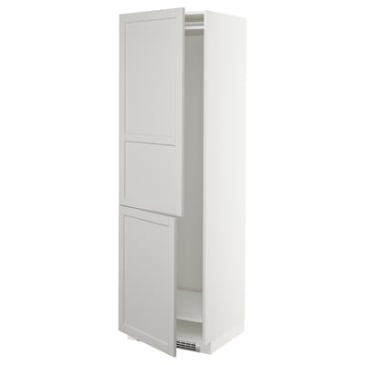 A white ikea METOD kitchen cabinet with two doors, one open, revealing adjustable shelves.