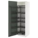 White kitchen cabinet with green door, pull-out shelves.