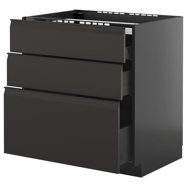 Modern black kitchen cabinet with three drawers and sleek, integrated handles.
