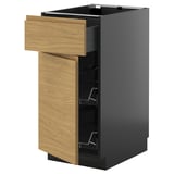 A METOD kitchen unit with a light wood drawer and black cabinet. It has an open drawer revealing wire racks inside.