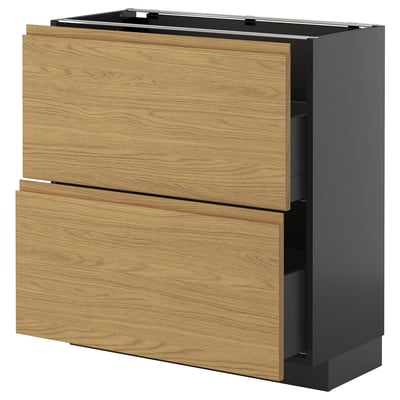 Shown is a modern kitchen cabinet from ikea METOD series, featuring oak-colored voxtorp fronts and a minimalist design.