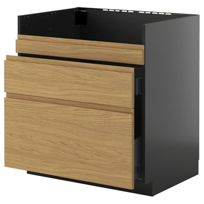 A modern black and oak kitchen unit with three drawers and minimalist handles. Part of the METOD system.