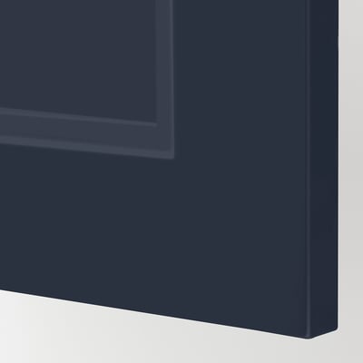 Dark blue kitchen cabinet detail, smooth finish. Modern, durable design with even paint application.
