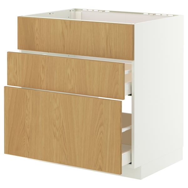 A white METOD kitchen unit with three wooden drawers. The unit is designed for storing kitchen essentials and has a sleek, modern appearance.