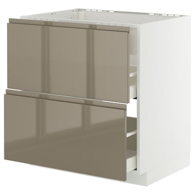An ikea METOD kitchen cabinet with white and brown high-gloss drawers. It has a sleek, modern design with integrated handles.