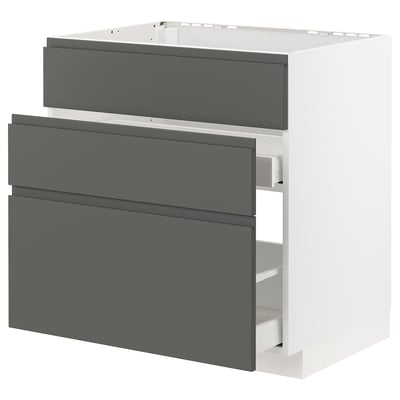 Modern kitchen unit, white with grey drawers. Mats dark grey. Integrated handles. Three drawers, smooth finish.