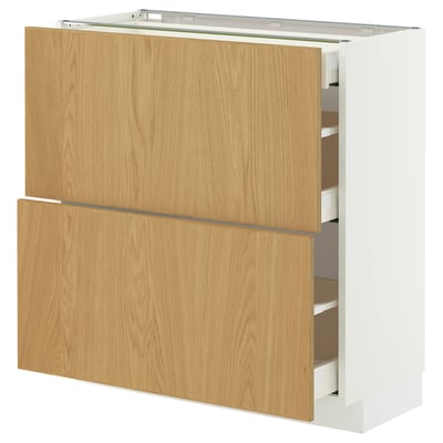 White METOD kitchen cabinet with oak drawers, two large, one small, sleek design.