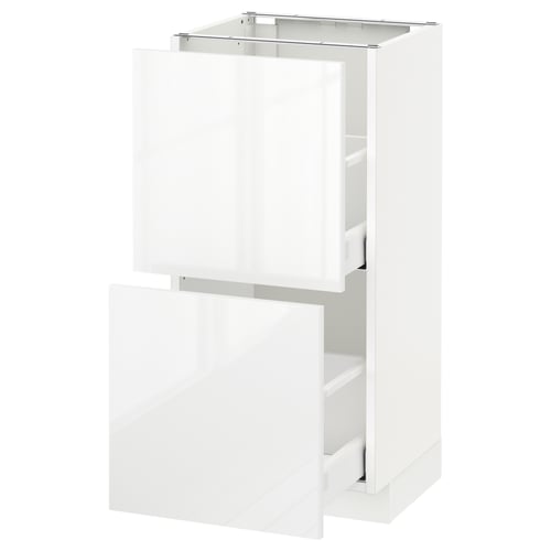 A white METOD kitchen cabinet with high-gloss ringhult fronts. It has multiple drawers for storage.