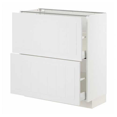 White METOD kitchen unit. Two cabinets with vertically grooved fronts and two drawers.