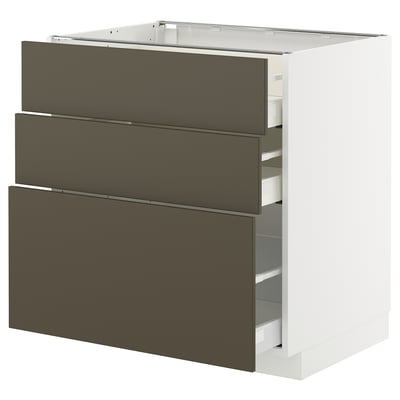 A METOD kitchen cabinet with three dark brown havstorp drawers. It stands vertically with a modern design.