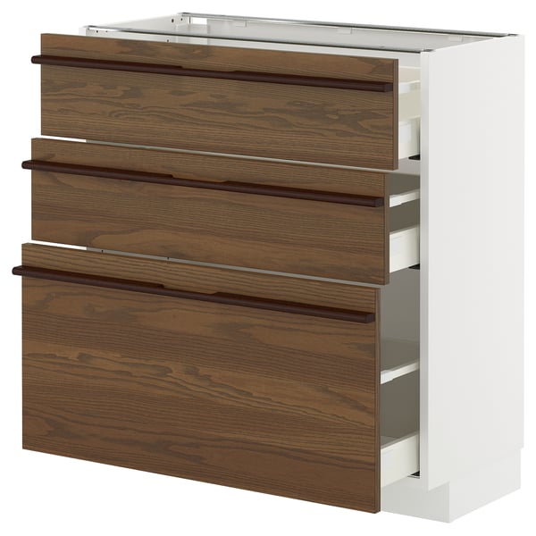 METOD kitchen unit with dark brown ash veneer drawers and wooden handles.