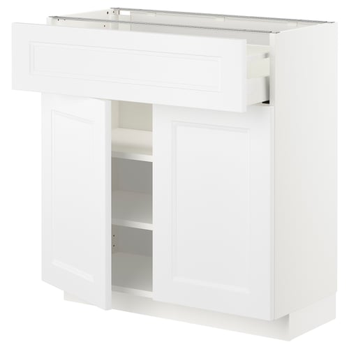 White METOD kitchen unit with drawers and shelves, sleek modern design.