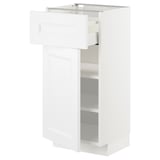 A white METOD kitchen cabinet with a drawer and shelves. Its rectangular, modern, and has a smooth finish.