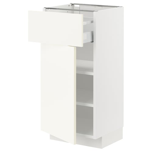 White METOD kitchen cabinet with open drawer, sleek design, adjustable shelves.
