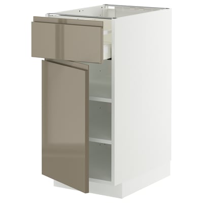Modern kitchen unit METOD with dark gray-brown handles, soft-close drawer, and adjustable shelf.