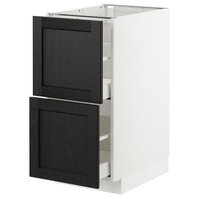 Modern kitchen cabinet with black stained wood doors and white frame.