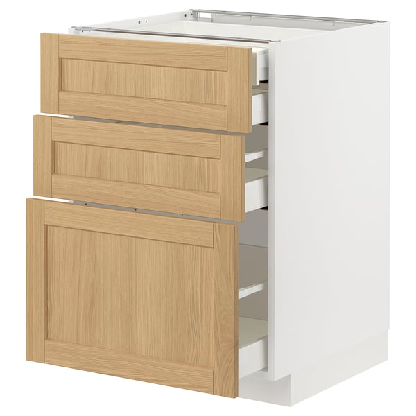 White METOD kitchen unit with oak drawers.