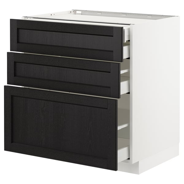 A modern white kitchen cabinet with three black wooden drawers; sleek and organized.