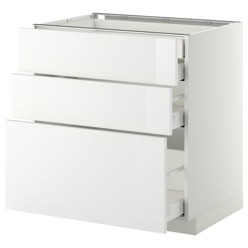 White glossy kitchen cabinet set with three drawers and a large drawer partially pulled out. Modern and sleek design.