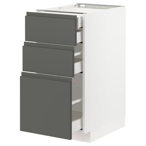 Modern grey drawers in white cabinet, vertical design.