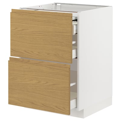 A white METOD kitchen cabinet with wooden drawers. It has a modern, minimalist design with integrated handles and oak-colored drawer fronts.