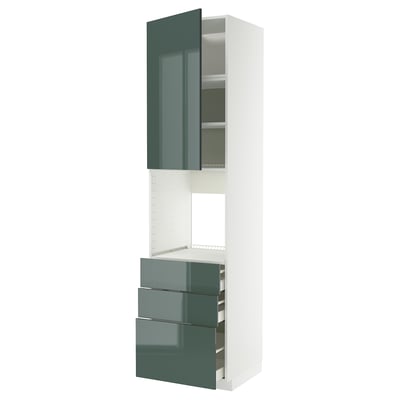 A modern, tall kitchen unit in white with high-gloss grey-green doors and drawers. It a combination of cabinets with drawers and shelving.