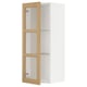 A white METOD kitchen cabinet with adjustable shelves and a light wooden frame. It glass doors with oak veneer.