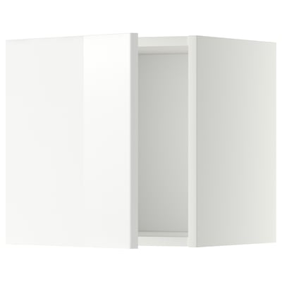 A white modern kitchen cabinet from ikeas METOD system with glossy doors.